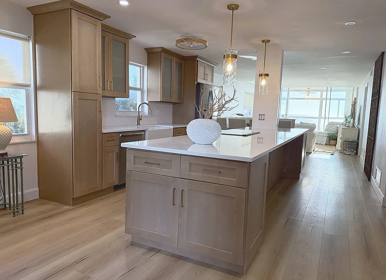 Venice-area full kitchen remodel with island cabinetry, countertops, hardware, flooring, and pendant lighting